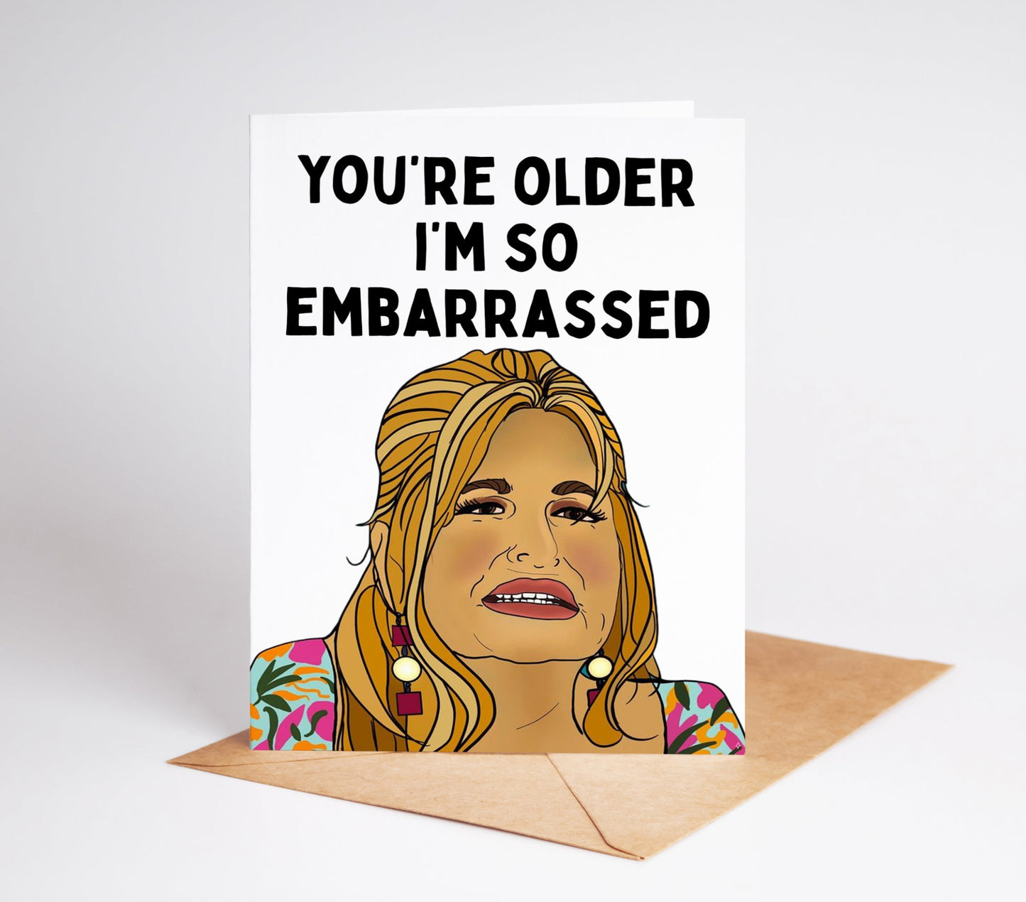 Celebrate another year of life with the Tanya Mcquoid White Lotus Birthday Card! This beautiful card features a hand drawn white lotus design and a humorous message that will bring a smile to anyone's face. 