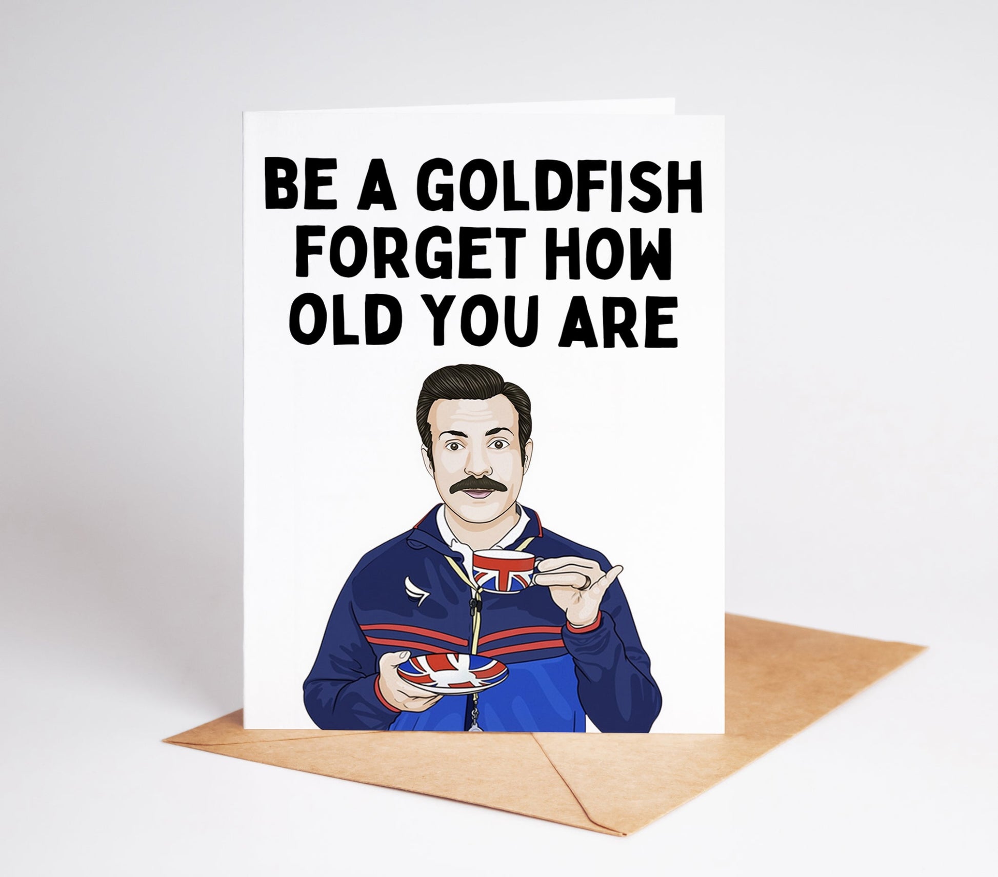 Celebrate any birthday with the Ted Lasso Birthday Card, featuring your favorite optimistic Coach Ted Lasso! Perfect for fans of the show, this card will bring a smile to anyone's face. Share the love and positivity with this one-of-a-kind card.