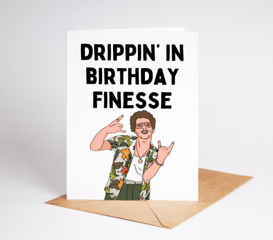 Celebrate a birthday with the popular musician Bruno Mars! This birthday card features a stylish design with a photo of Bruno Mars himself. Perfect for fans and music lovers, this card will bring joy and excitement on their special day.