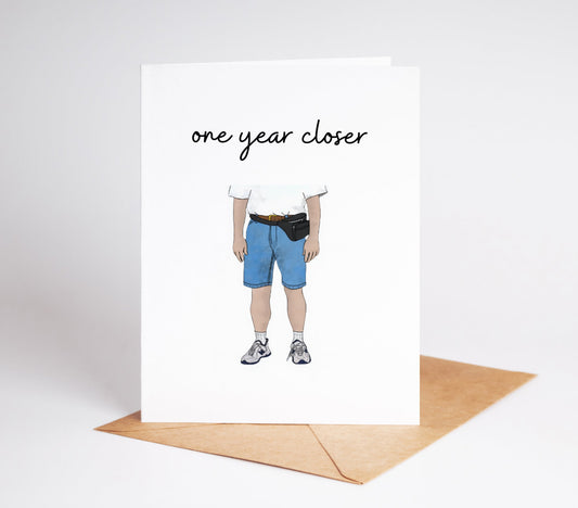 Celebrate another year of dad style with our One Year Closer Funny Birthday Card! As your dad becomes one year closer to the ultimate dad look, complete with dad shoes and fanny packs, this card is the perfect way to add some humor to their special day.&nbsp;